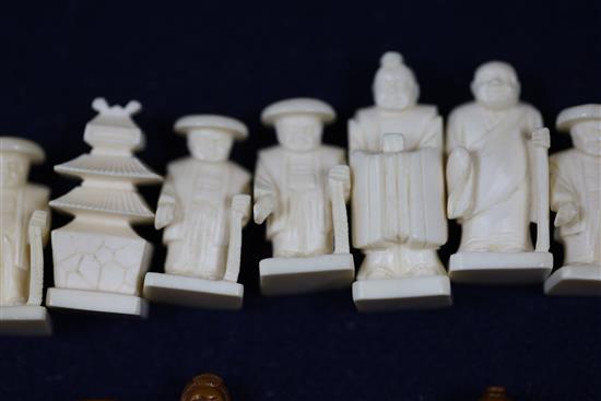 An unusual late 19th century Japanese brown stained and natural ivory figural chess set, kings 1.75in.